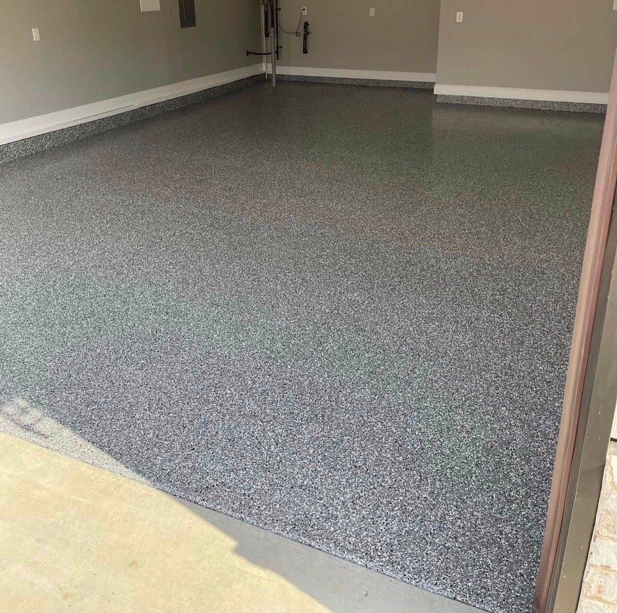 Finished gray flake coating on a garage floor